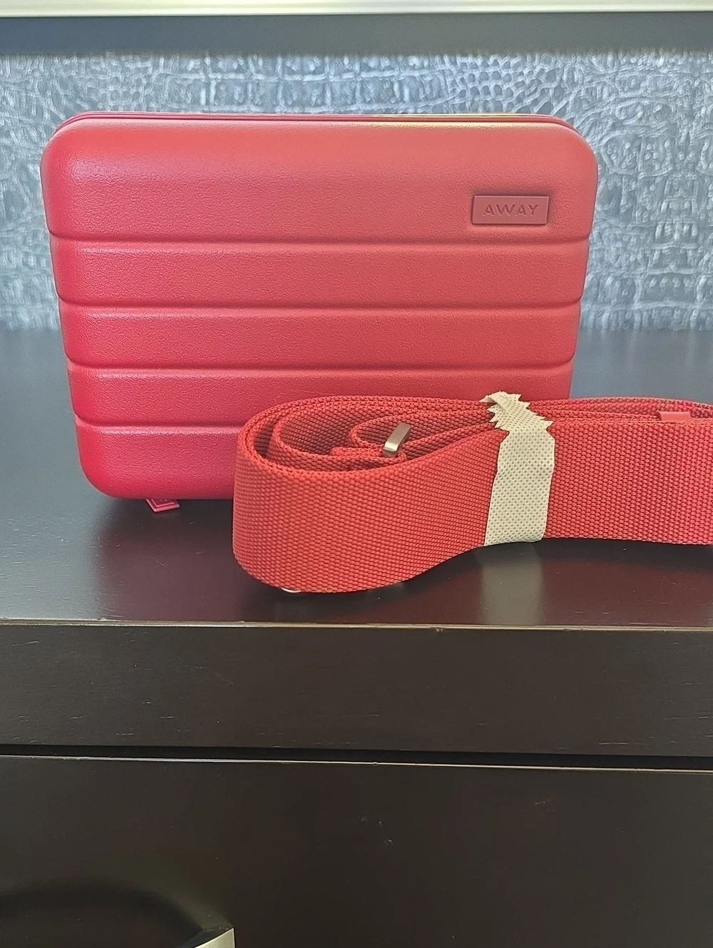 Away Small Hard-Shell Crossbody Case in Tango Red with Matching Strap